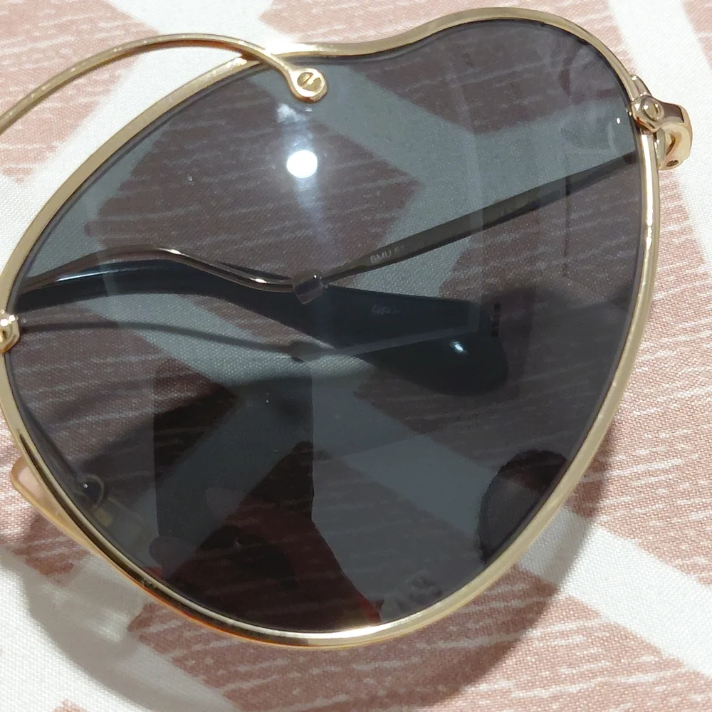Miu Miu Gold Frame Sunglasses with Black Lenses